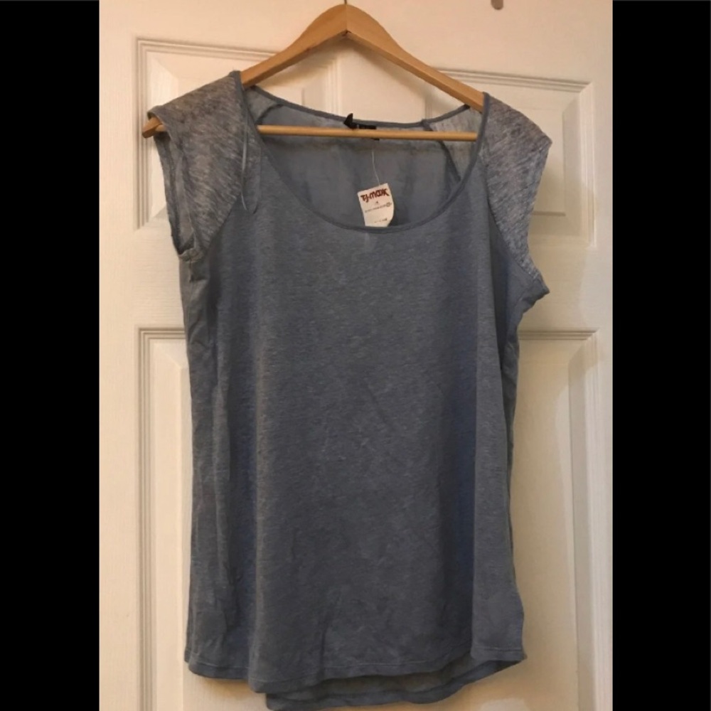 New with tag, Woman’s blue shirt paid 16.99